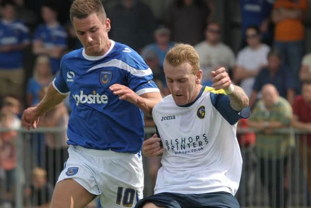 Perry Ryan, right, in pre-season action for the Hawks against Pompey last season Picture: Mick Young