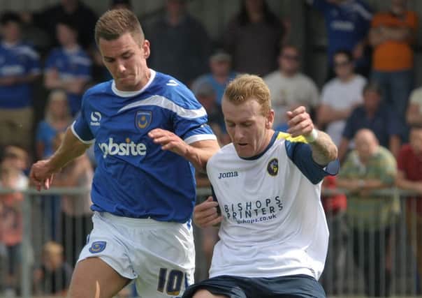 Perry Ryan, right, in pre-season action for the Hawks against Pompey last season Picture: Mick Young