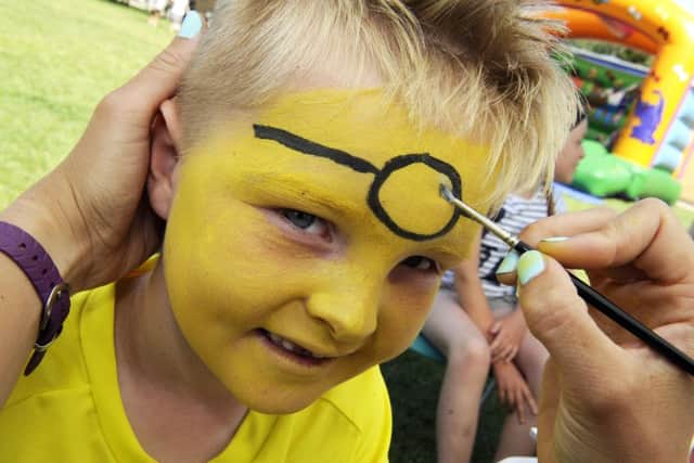 Harry Robinson, six,on the way to becoming a Minion Picture:  Malcolm Wells (150627-5219)