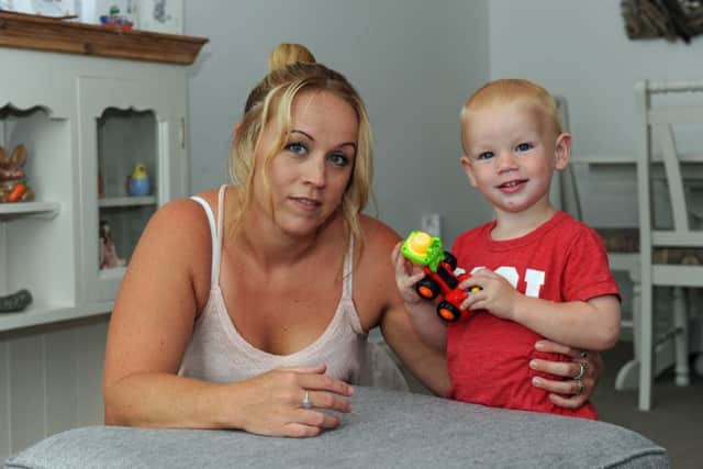 Clare Weeks from Hayling Island and her son Bobby Bradley who is recovering after being struck by a woman riding a mobility scooter
Picture: Ian Hargreaves (151156-5)