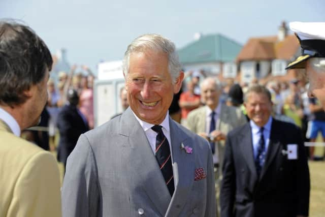 HRH Prince Charles meets his relative Timothy Knatchbull with, right, Rear-Admiral John Lang, a Deputy Lieutenant of Hampshire   Picture: Malcolm Wells (150701-4721)