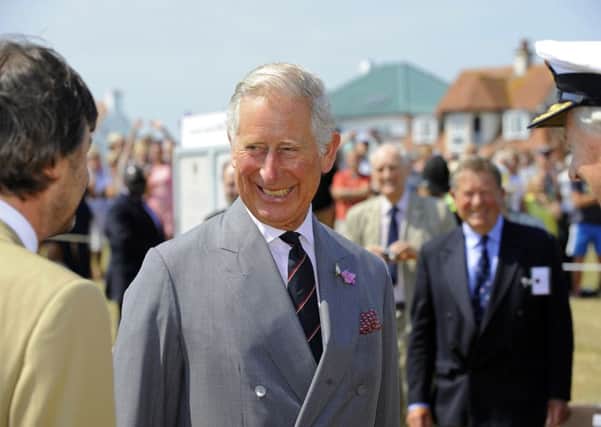 HRH Prince Charles meets his relative Timothy Knatchbull with, right, Rear-Admiral John Lang, a Deputy Lieutenant of Hampshire Picture: Malcolm Wells (150701-4721)