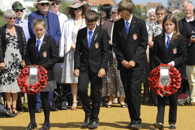 Pupils from Hayling College lay wreaths on The COPP Memorial 

Picture: Malcolm Wells (150701-4784)