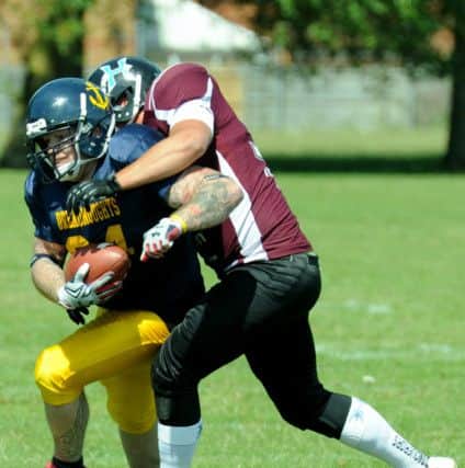 Portsmouth Dreadnoughts player Will Purkiss is tackled by a Hastings Conquerors player (151030-6)