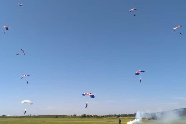 The RAF Falcons parachute display team coming in to land SUS-150822-204234001