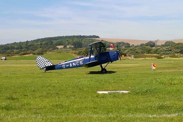 One of the six Tiger Moths fllying at Shoreham today SUS-150822-204338001