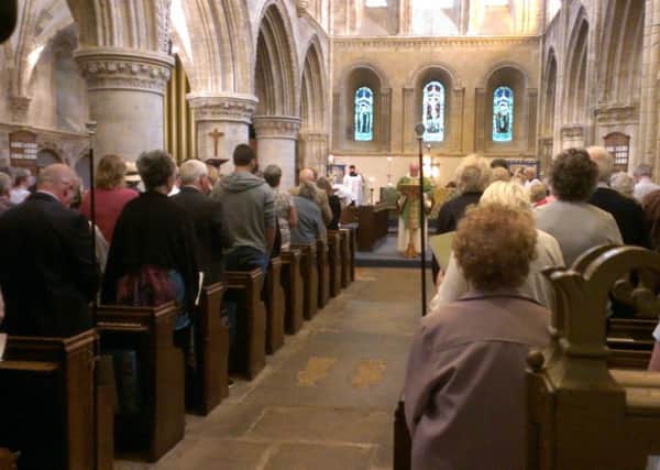 Father Paul Rampton leading the special service at St Mary de Haura Church this morning