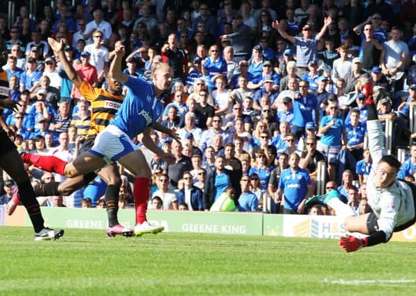 Adam McGurk scores in the second half to give Pompey the lead against Barnet Picture: Joe Pepler