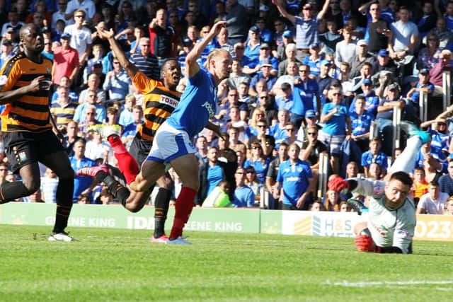Adam McGurk scores Pompey's second goal against Barnet on Saturday Picture: Joe Pepler