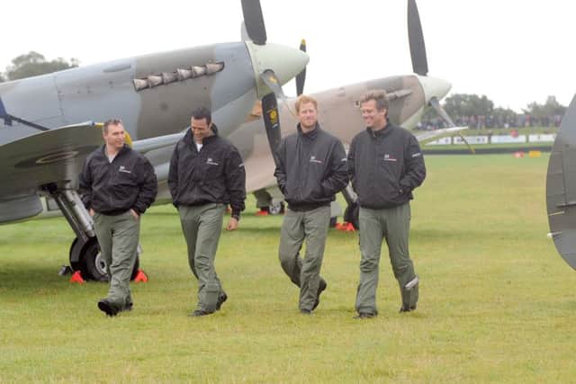 HRH Prince Harry took part in the Battle of Britain Flypast at Goodwood Aerodrome.
Pictured is: (l-r) Alan Robinson, Nathan Forster, HRH Prince Harry and Matt Jones.
Picture: Sarah Standing (151575-5530)