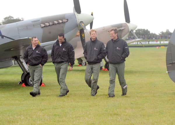 HRH Prince Harry took part in the Battle of Britain Flypast at Goodwood Aerodrome.
Pictured is: (l-r) Alan Robinson, Nathan Forster, HRH Prince Harry and Matt Jones.
Picture: Sarah Standing (151575-5530)