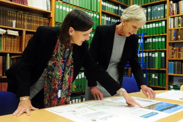 Wendy Walker, County Archivist with Louise Goldsmith, Leader of West Sussex County Council, looking at some of the messages left. ks1500488-1 SUS-150928-164211008