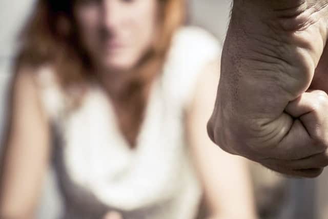 A woman at risk of domestic abuse, as posed by actors