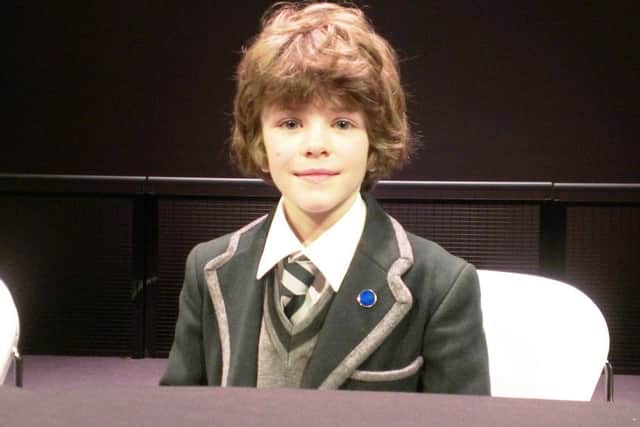 Rufus Knight, 8, a pupil at Oakwood School in Chichester, takes a seat in Major Tim Peake's seat. Rufus went along to a press conference with his father Andrew - where he got to meet Mr Peake, an astronaut from Chichester