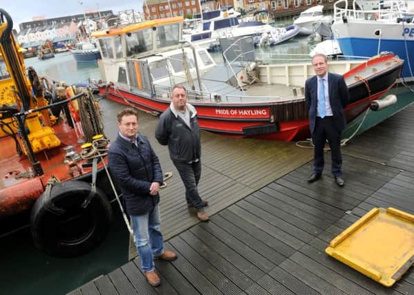 From left, ferry user and supporter Andrew Rothwell, ferry owner Tim Trayte  and Cllr Michael Wilson 

Picture: Sarah Standing (151947-4170)