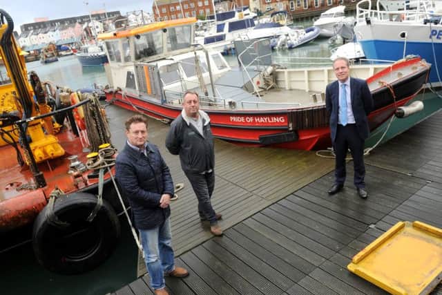 From left, ferry user and supporter Andrew Rothwell, ferry owner Tim Trayte  and Cllr Michael Wilson Picture: Sarah Standing (151947-4170)