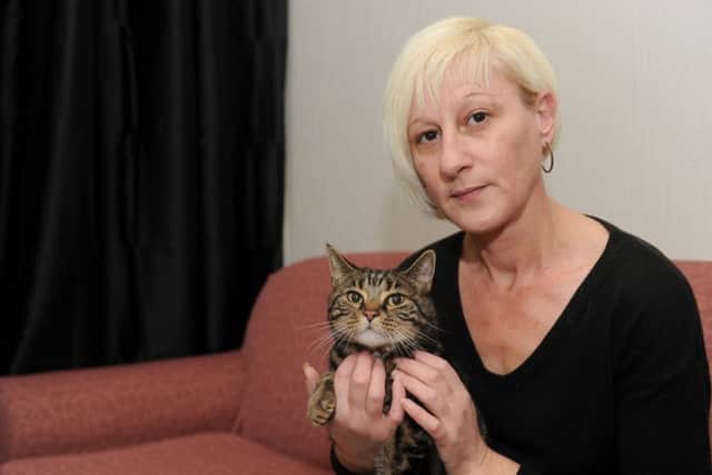 Tracey Hall, the partner of the late Marco Araujo, faces eviction from her council home which she shares with her mum. Tracey is pictured with her cat Mickey, which was given to her by Marco Picture: Sarah Standing (160080-7180)