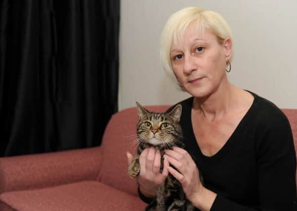 Tracey Hall, the partner of the late Marco Araujo, faces eviction from her council home which she shares with her mum. Tracey is pictured with her cat Mickey, which was given to her by Marco Picture: Sarah Standing (160080-7180)