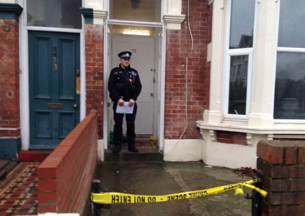 A policeman guards a house in Waverley Road as part of the investigation into the death of Christopher Butler