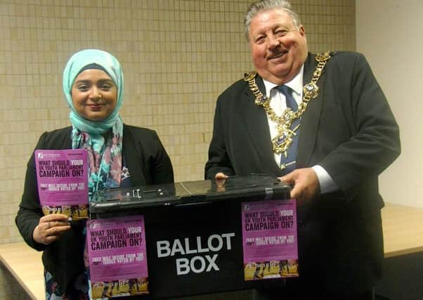 ELECTION Portsmouth Youth Parliament chair Sayeeda Nur and Mayor Frank Jonas counting votes in the youth parliaments Make Your Mark consultation