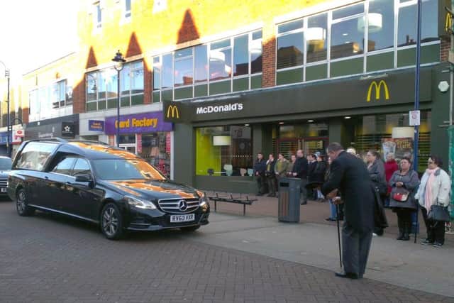 The funeral cortege of Chris Woodford stops outside McDonald's in Gosport high street, where she worked for many years