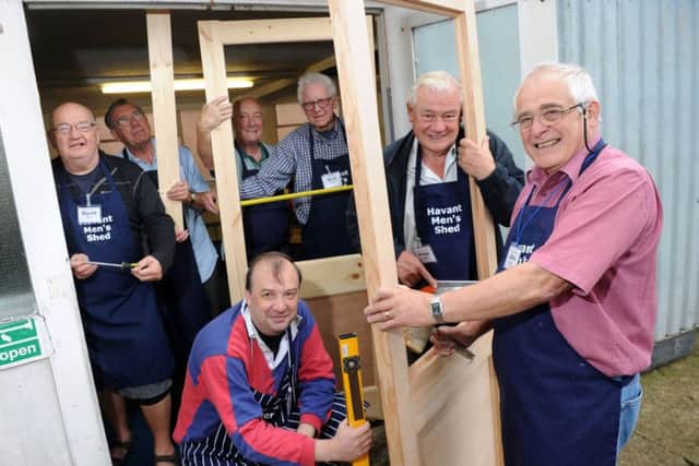 From left, David Marsh, Alex Brooks, Stephen Sadler, Dominic Farifax, Nick Mooney , Peter Wright and John Worley working on replacement doors at Havant Men's Shed Picture: Allan Hutchings (142901-646)