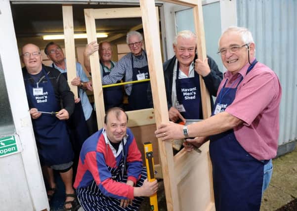 From left, David Marsh, Alex Brooks, Stephen Sadler, Dominic Farifax, Nick Mooney , Peter Wright and John Worley working on replacement doors at Havant Men's Shed Picture: Allan Hutchings (142901-646)
