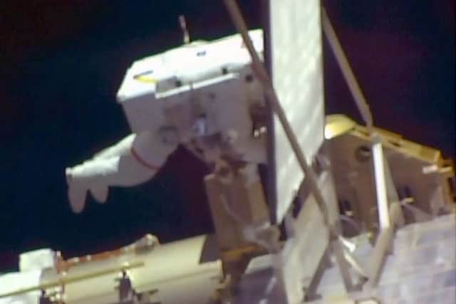 Tim Peake is tethered to the space station during the work