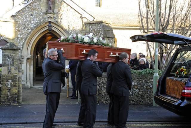 The coffin of Frida Edwards is carried by pallbearers from the hearse at St Joseph's Church in West Street, Havant Picture: Malcolm Wells (160114-5371)