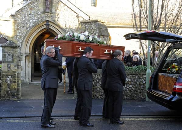 The coffin of Frida Edwards is carried by pallbearers from the hearse at St Joseph's Church in West Street, Havant 

Picture: Malcolm Wells (160114-5371)