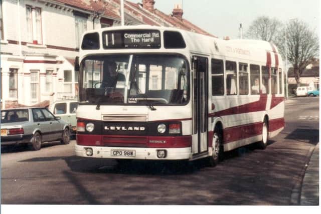 A Leyland National 2 passes thorugh New Road, Copnor, on a spring day in 1982