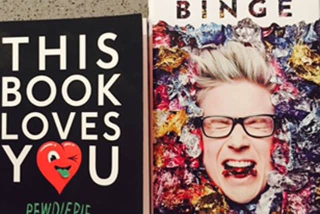 Books by YouTube stars PewDiePie, left, and Tyler Oakley