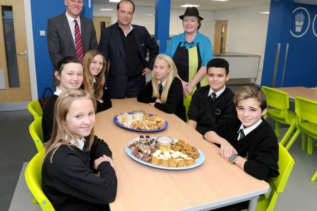 Back row, from left, headteacher Ian Gates, MP George Hollingbery and catering manager Helen Sandham  with students at Cowplain Community School Picture: Sarah Standing (160100-8283)