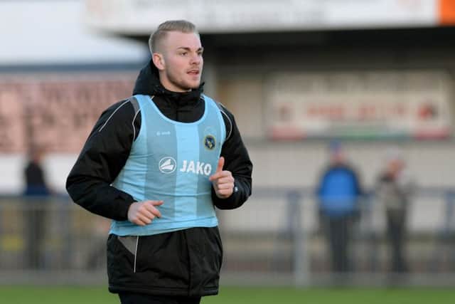 Jack Whatmough warms up before featuring in the Hawks' FA Trophy win over Welling. Picture: Paul Jacobs (160012-26)