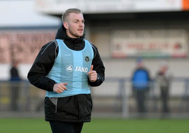 Jack Whatmough warms up before featuring in the Hawks' FA Trophy win over Welling. Picture: Paul Jacobs (160012-26)