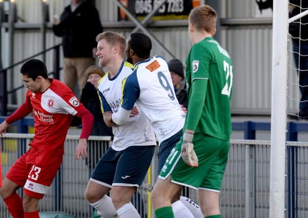 Josh Hill celebrates his goal with Shamir Mullings. Picture: Paul Jacobs (160012-2)