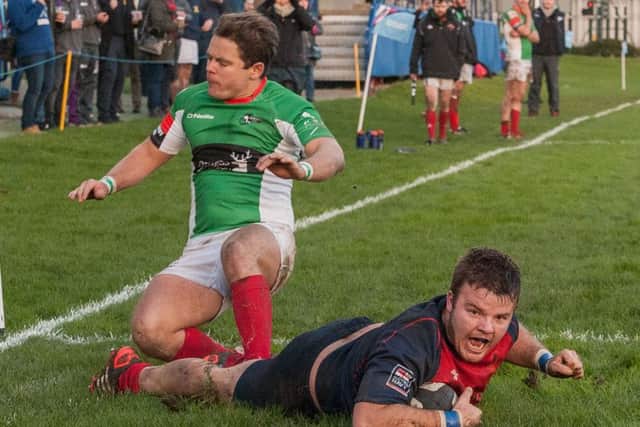 Dougie Randall scores United Services' third try in their clash with Battersea Ironsides. Picture: Keith Woodland