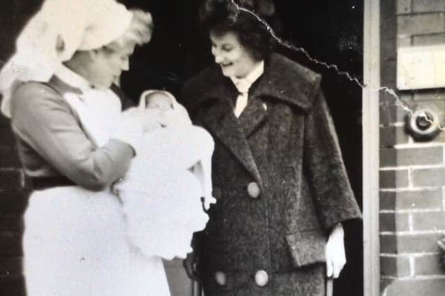 Patricia Bryant taking home her son Mark from Eddystone Maternity Home in May 1963. Mark is held by Matron Scott.