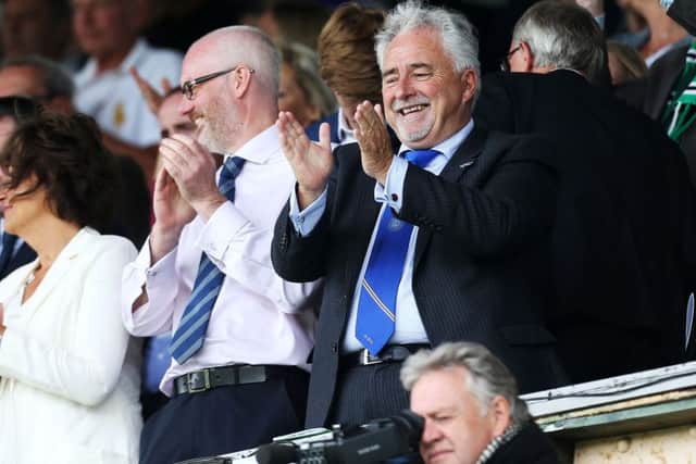 Ashley Brown, left, with club chairman Iain McInnes Picture: Joe Pepler