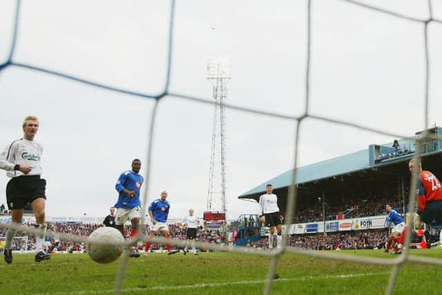 Richard Hughes' strikes sees off the challenge of Liverpool in 2004