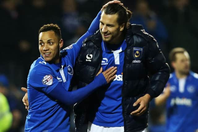 Pompey defender Christian Burgess, right   Picture: Joe Pepler