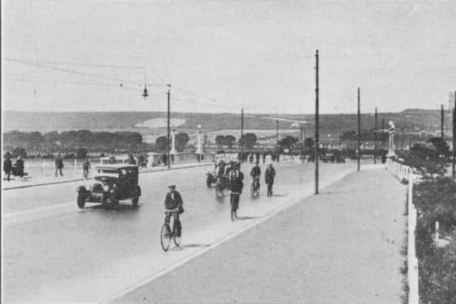 Looking north over Portsbridge in 1928 with tram lines down the centre of the road.