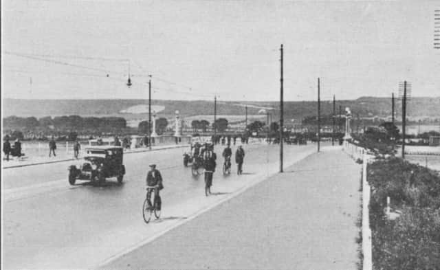 Looking north over Portsbridge in 1928 with tram lines down the centre of the road.