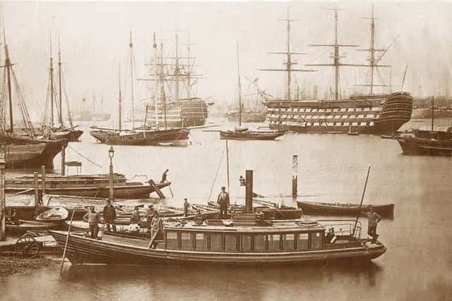 OLD AND NEW A steamboat in Portsmouth Harbour with HMS Victory, right, and HMS Wellington, left, both first rate ships of the line with 100 or more guns