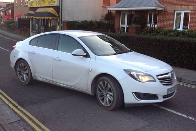 Oladipo Adegbesan of Fair Acre Rise, Fareham, leaving court in his car after he appeared charged with two counts of assault by beating on a traffic warden