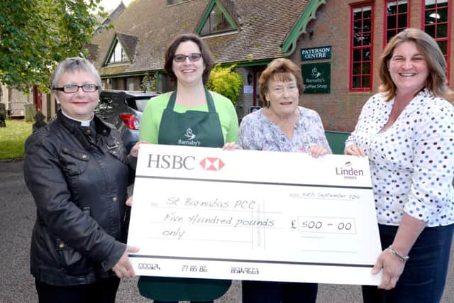 The Â£500 cheque is presented at the Paterson Centre