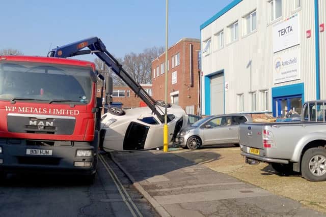 A crane upends vehicles in Aston Road, Waterlooville Picture: Martyn Hoskins