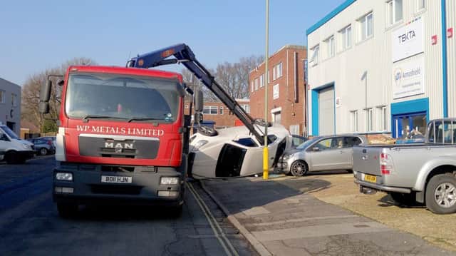 A crane upends vehicles in Aston Road, Waterlooville  Picture: Martyn Hoskins