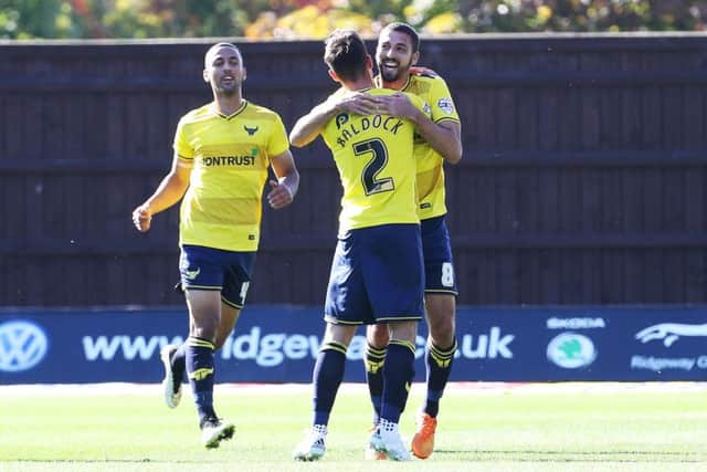 Oxford's Liam Sercombe celebrates scoring against Pompey earlier in the season. Picture: Joe Pepler