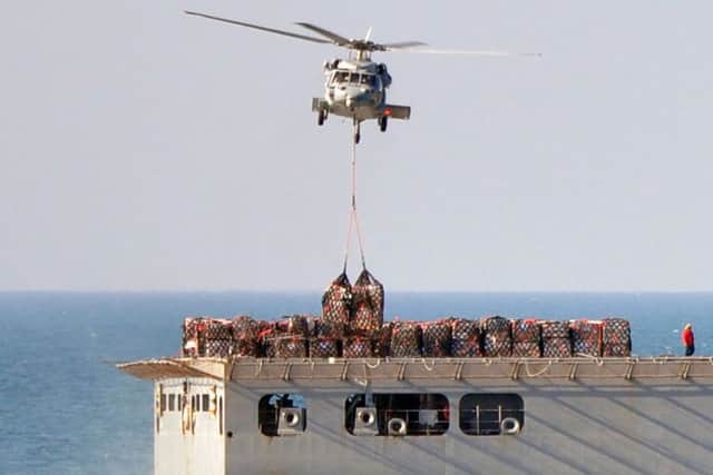 About 2,500 tonnes of stores were transferred by helicopter from the USNS Medgar Evers to USS Harry S Truman. in an operation that  HMS Defender took part in